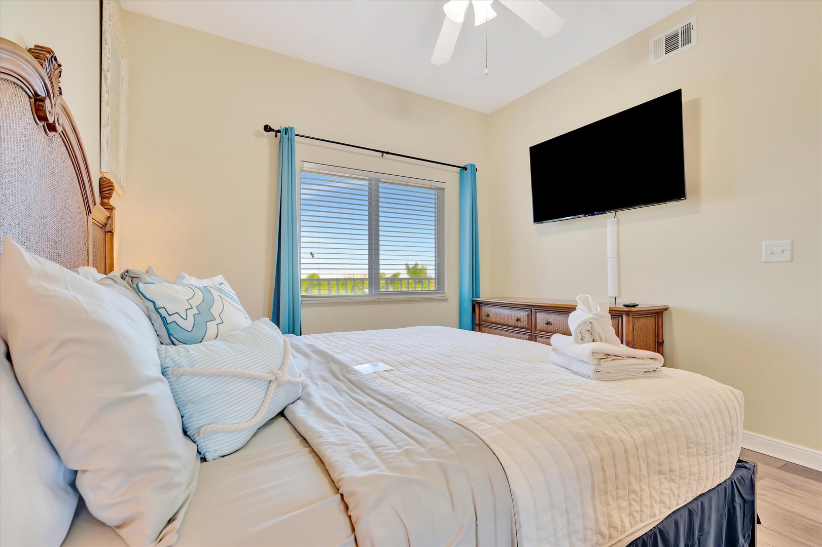 Slip into crisp linens and let ocean breezes drift through the window as you unwind in your coastal-inspired bedroom retreat.
