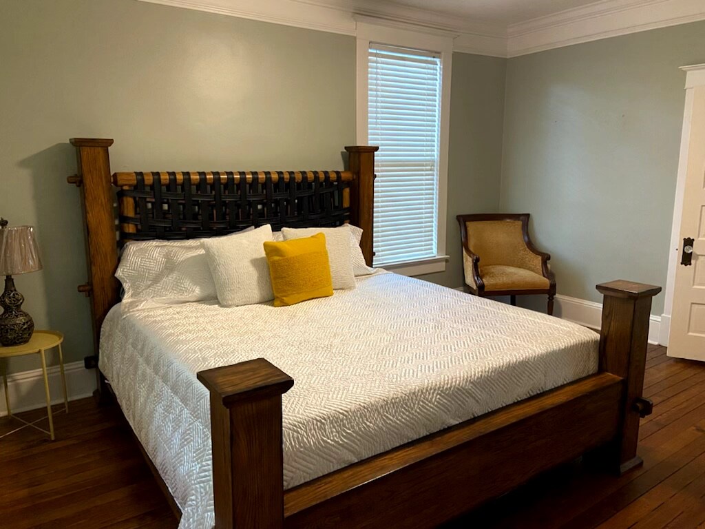 Sink into crisp linens and plush pillows after a day exploring. Your peaceful bedroom offers soft lighting, a cozy reading chair, and calming tones to help you unwind.