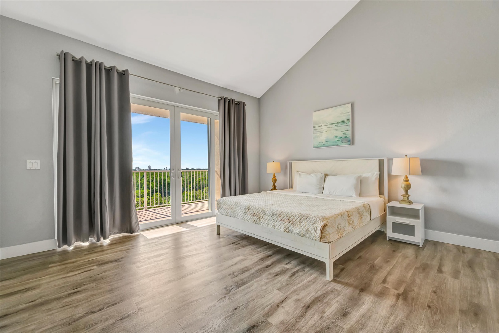 Drift off to sleep in your serene retreat, where soft morning light and fresh greenery greet you through private balcony doors. Your peaceful escape awaits.