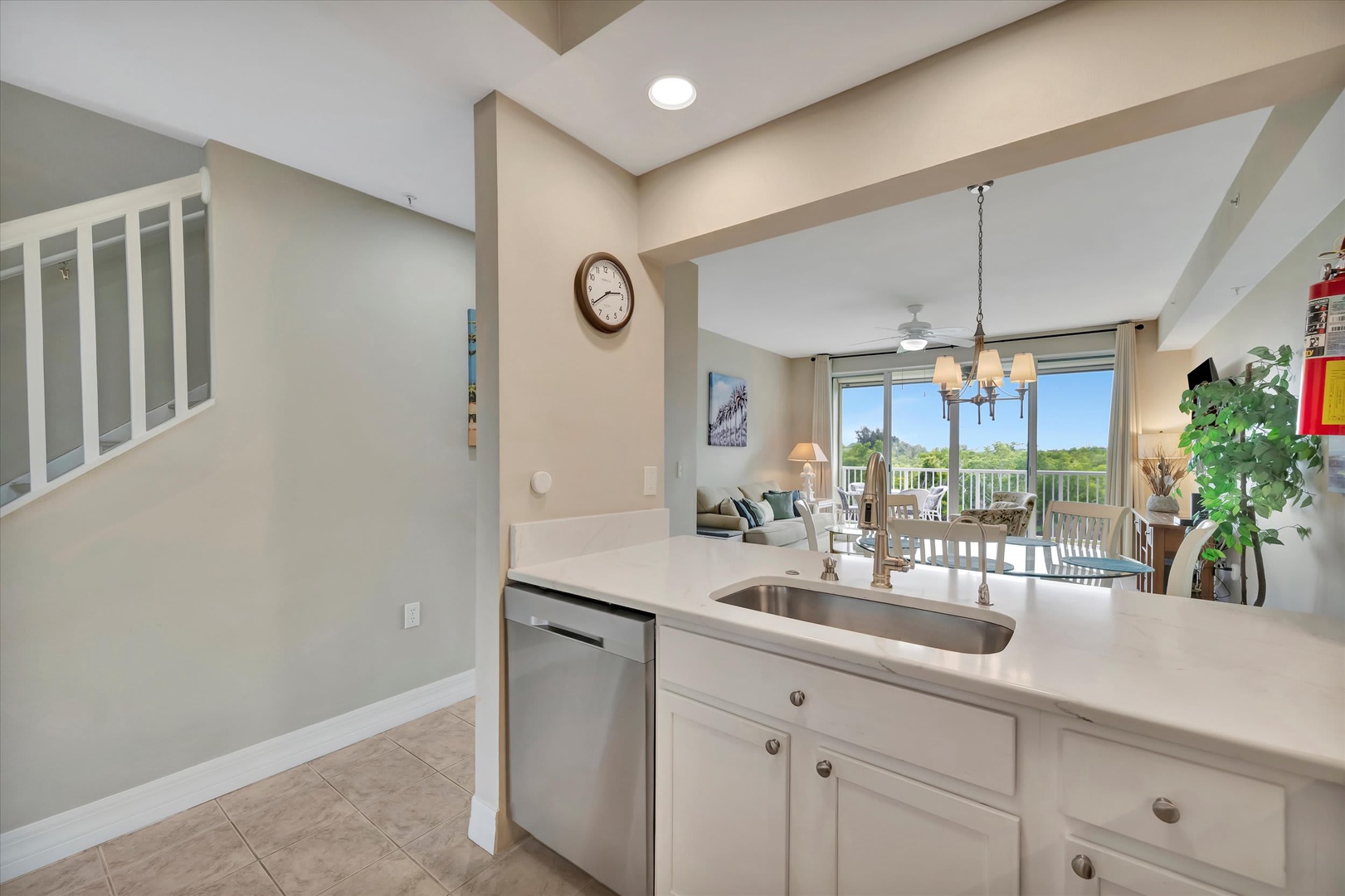 Step into your open-concept living space where the kitchen flows seamlessly into bright, airy living areas. Natural light pours through the balcony doors, inviting you to relax and feel right at home.