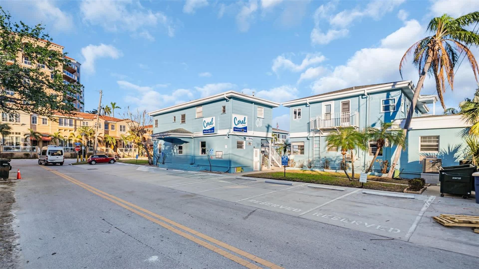 The property sits in a vibrant coastal neighborhood with palm trees and nearby restaurants, just steps from local shops and attractions. A welcoming tropical setting for your beach getaway.