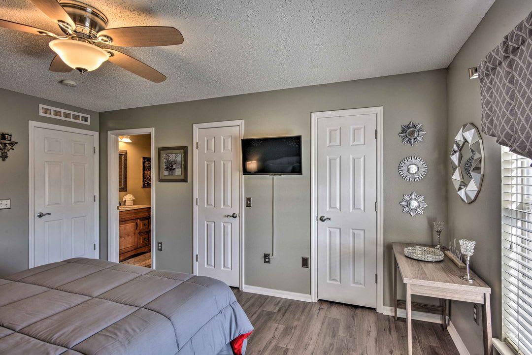Relax in your peaceful bedroom retreat with soft linens, a gentle ceiling fan, and plenty of storage space to settle right in.