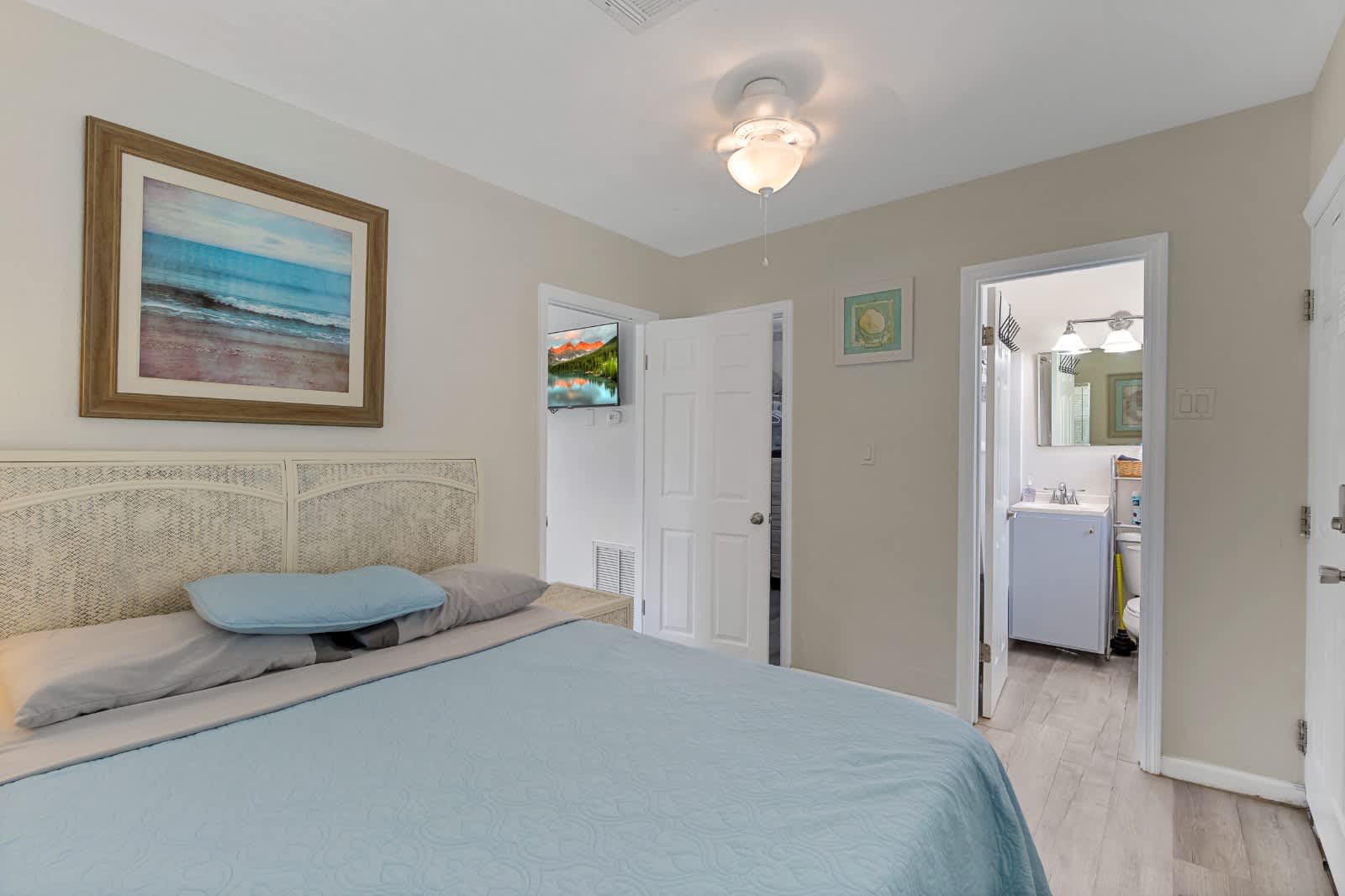 Drift off to sleep in your restful bedroom, where soft colors and coastal touches create a peaceful retreat. The ensuite bath is just steps away for your convenience.