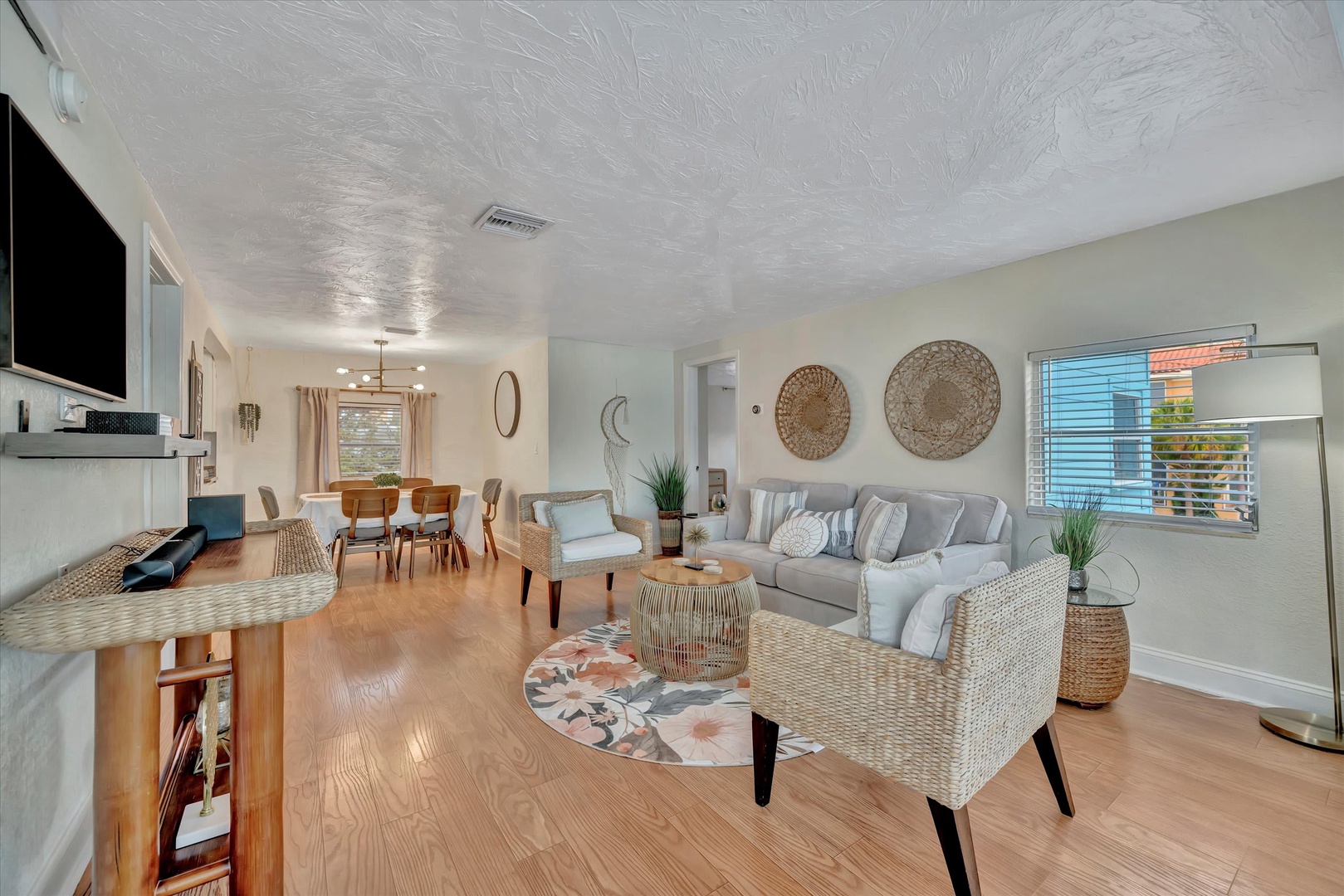 Unwind in your spacious living area, where natural textures and soft tones create a warm, inviting atmosphere for relaxing after a day of adventure.