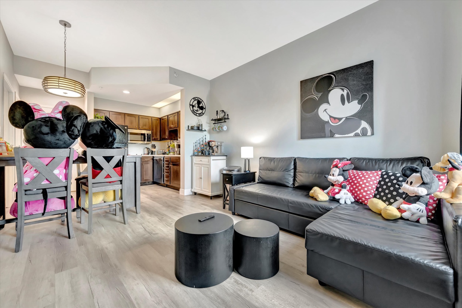 Relax in your stylish open living space with comfy seating and a fully equipped kitchen. The fun Disney-themed decor adds charm and whimsy, perfect for families or fans looking to unwind after a day of adventure.