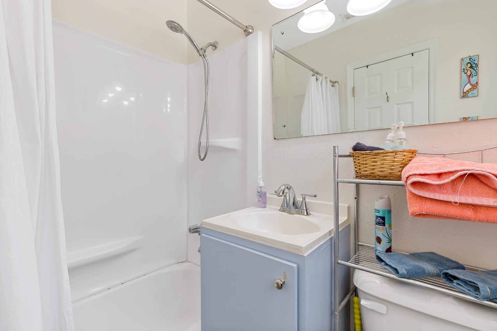 Step into your refreshed private bathroom, where fresh towels and thoughtful touches await you after a day of exploring.