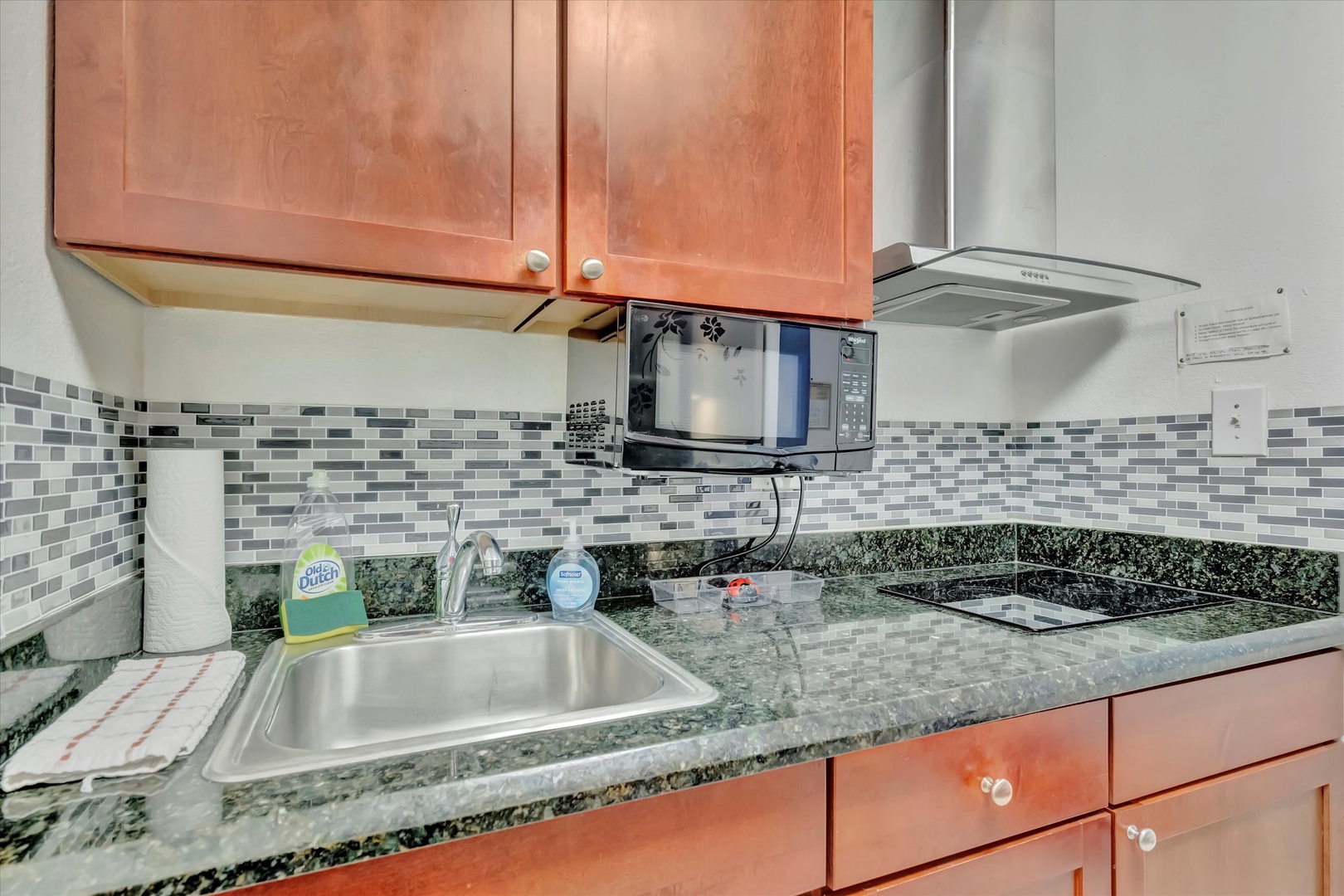 Your fully equipped kitchen features granite countertops, stainless steel appliances, and everything you need to prepare meals during your stay.