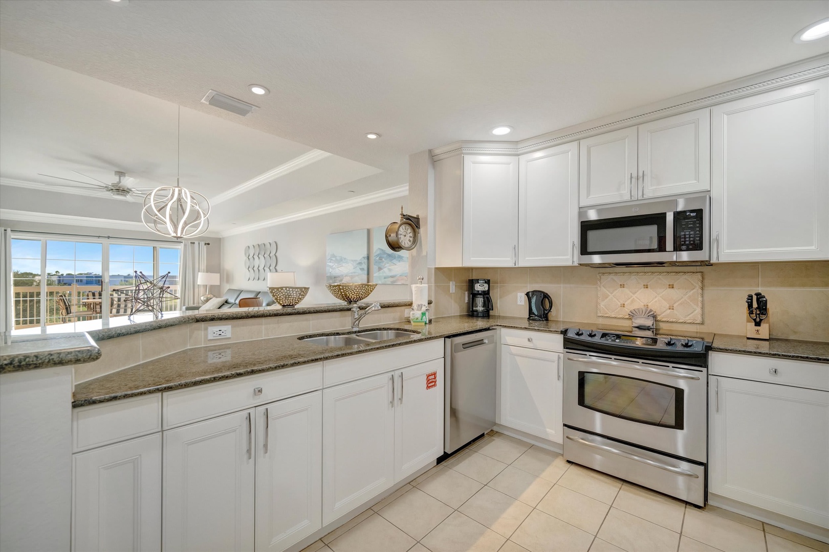 Step into your fully equipped kitchen with gleaming granite counters, stainless steel appliances, and bright natural light streaming through the windows. Prepare your morning coffee or whip up a delicious meal while enjoying the open, airy space.