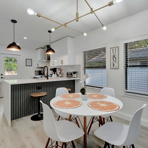 Gather around this bright, stylish dining area that flows into your fully equipped kitchen. Light-filled, open, and inviting—perfect for morning coffee or evening meals.