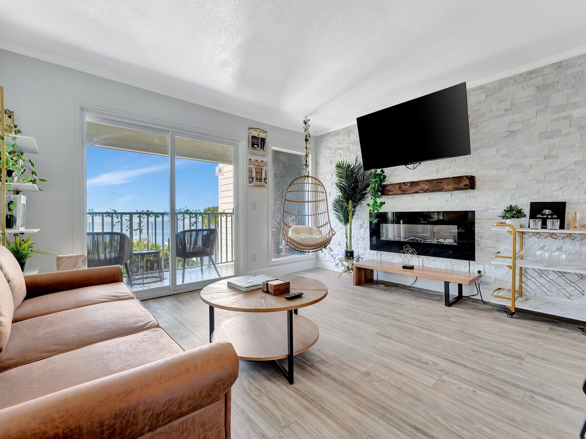Sink into the plush sofa and let your eyes drift across the chic fireplace and modern décor. Slide open the balcony doors to feel the breeze and soak in your peaceful surroundings.
