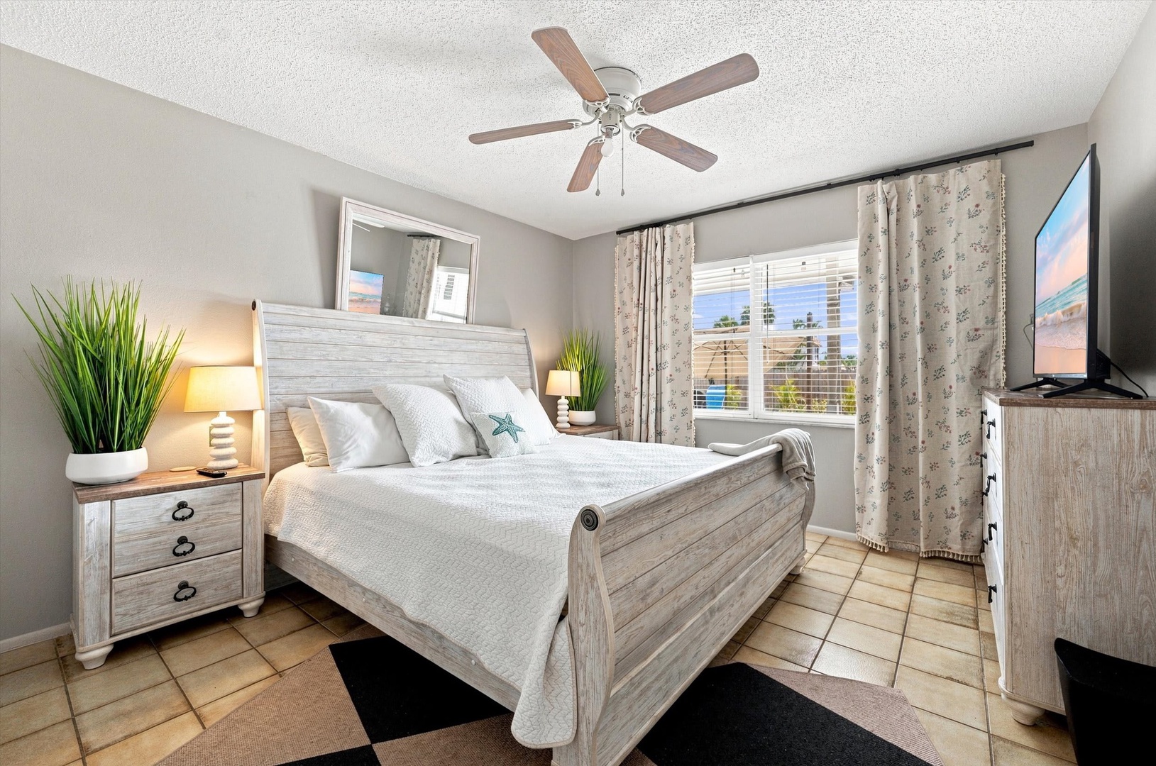 Your coastal retreat awaits with a plush sleigh bed, soothing whitewashed wood furnishings, and soft lighting to help you unwind after a day in the sun.