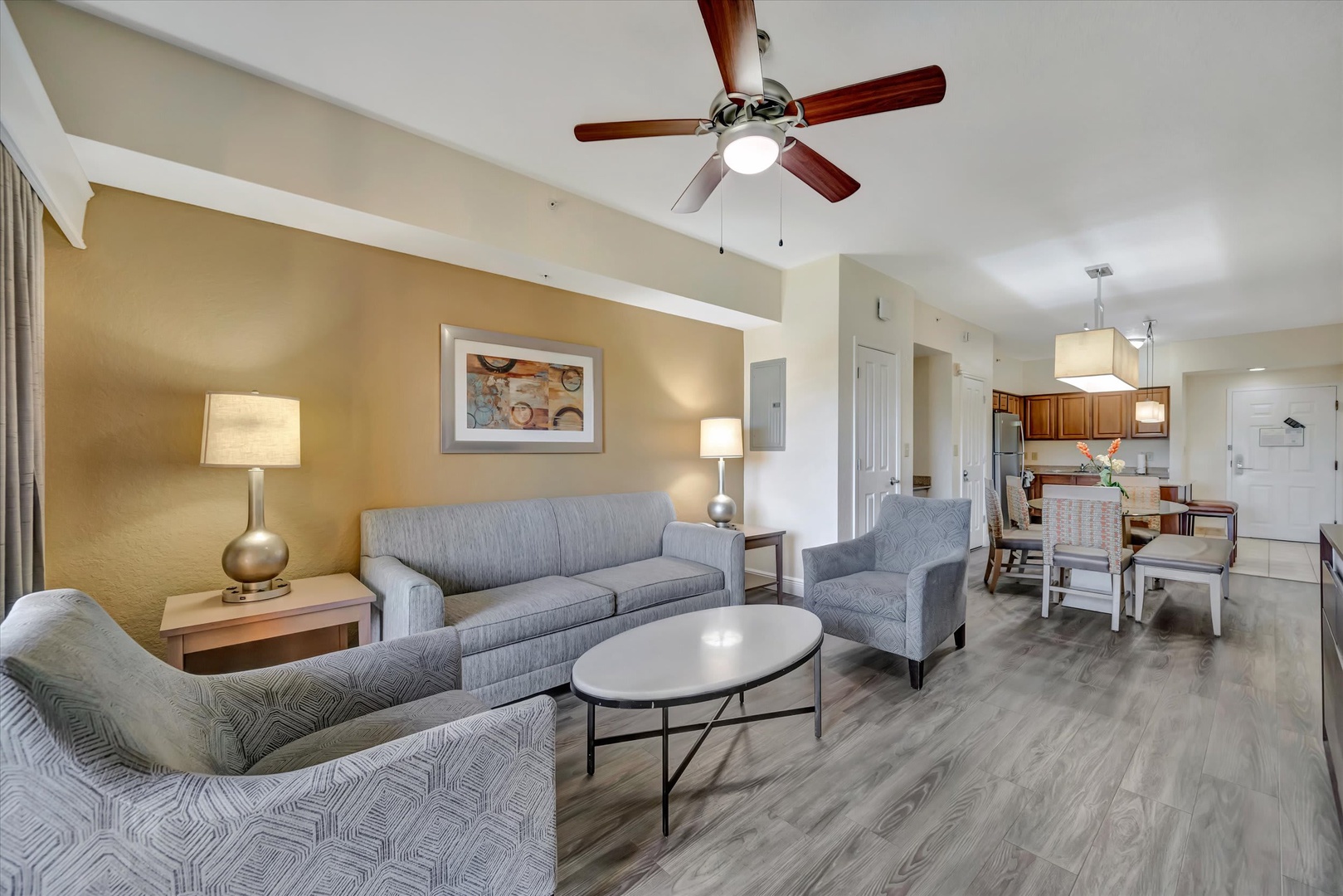 Settle into your spacious open-concept living area, where stylish furnishings and a calming color palette create the perfect retreat after a day of adventure.