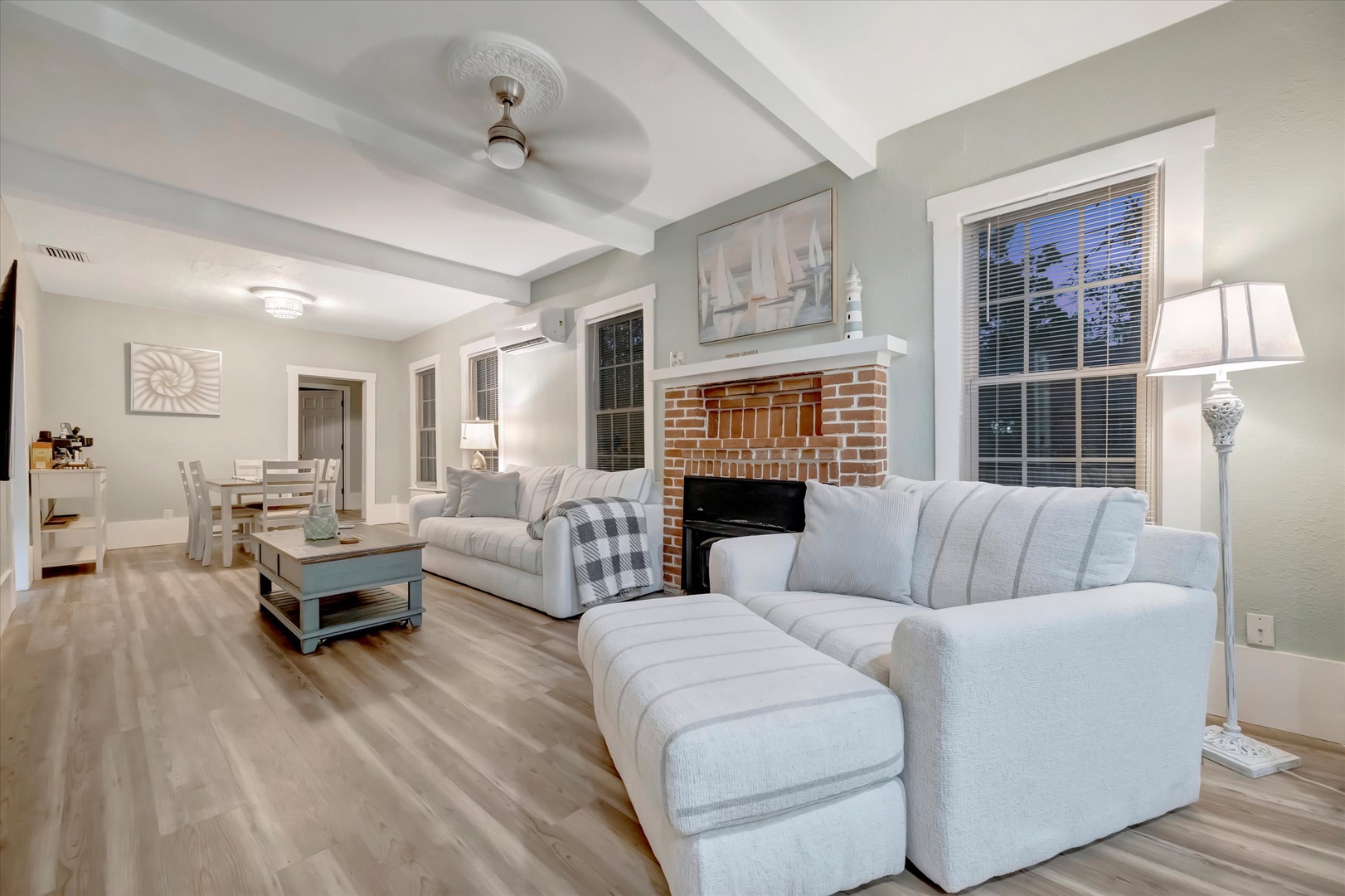 Unwind in your spacious living room with vaulted ceilings, cozy fireplace, and plush seating perfect for relaxing evenings with loved ones.