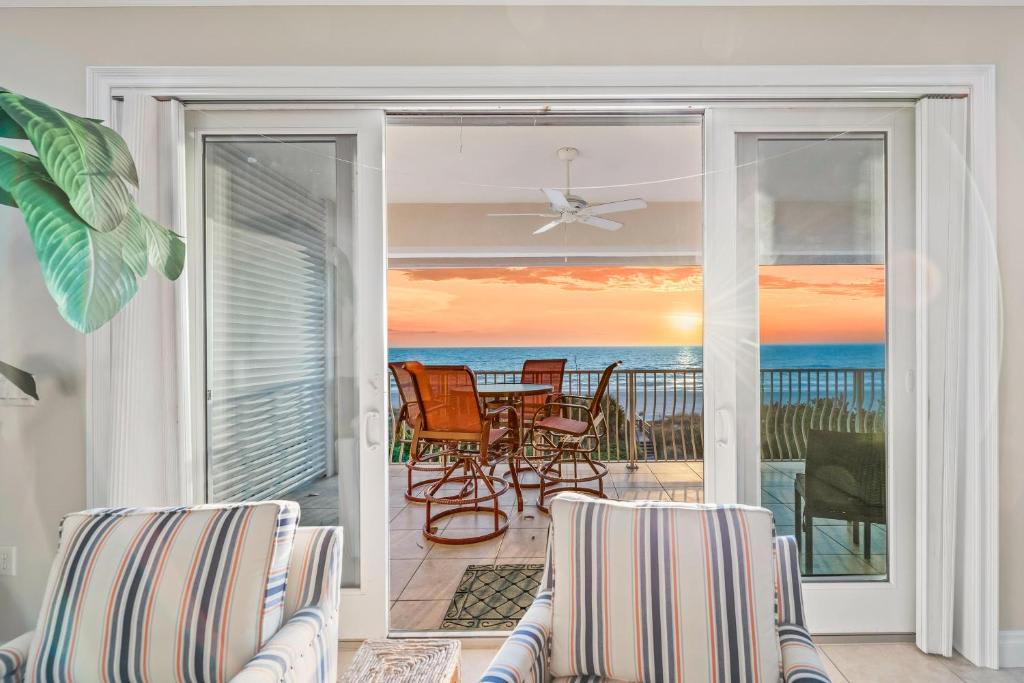 Step from your living room onto a private balcony where ocean waves roll in view and sunsets paint the sky every evening. Your outdoor table awaits lazy mornings and twilight happy hours.