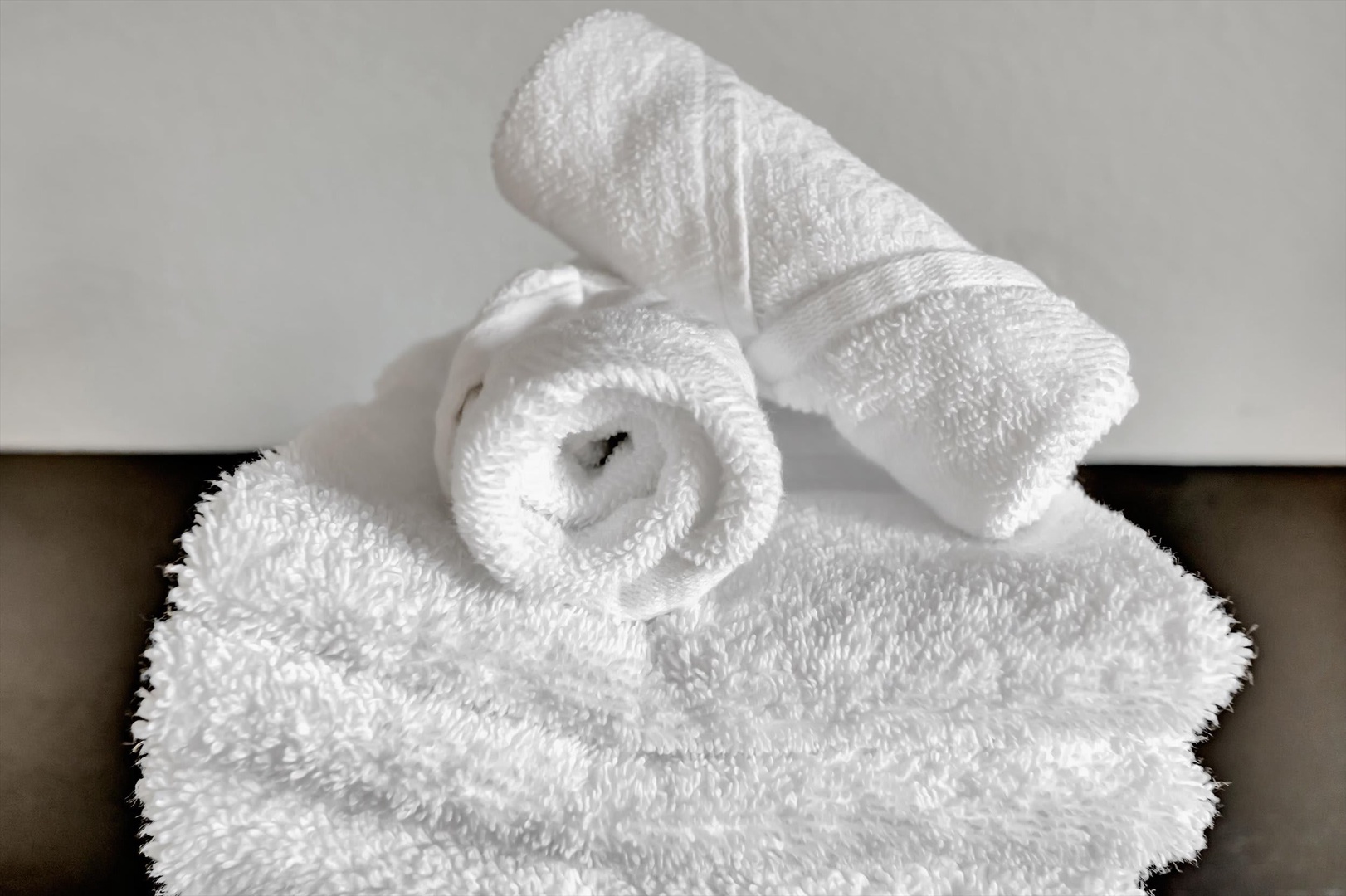 Fresh, plush towels await you—perfectly folded and hotel-soft, ready to wrap you in comfort after every shower or soak.