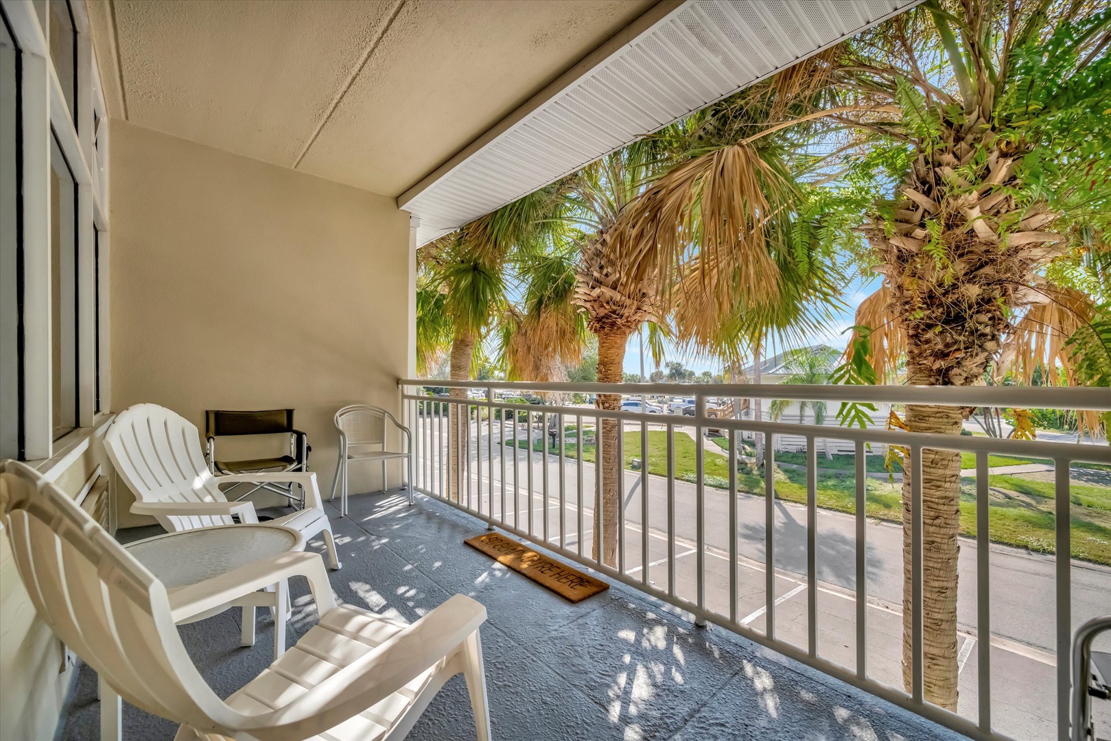 Step onto your private balcony and settle into an Adirondack chair with your morning coffee, soaking up tropical breezes and swaying palm views just beyond the railing.