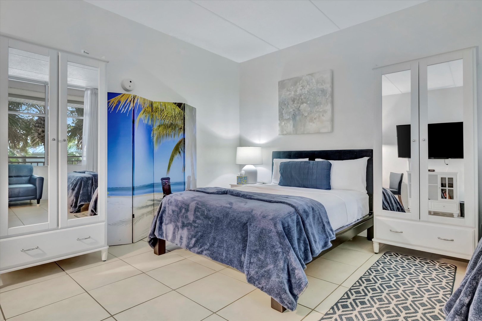 Slip into crisp white linens under a plush throw and let the coastal palette wrap around you. Your peaceful bedroom retreat features ample storage and a calming ambiance for dreamy vacation nights.