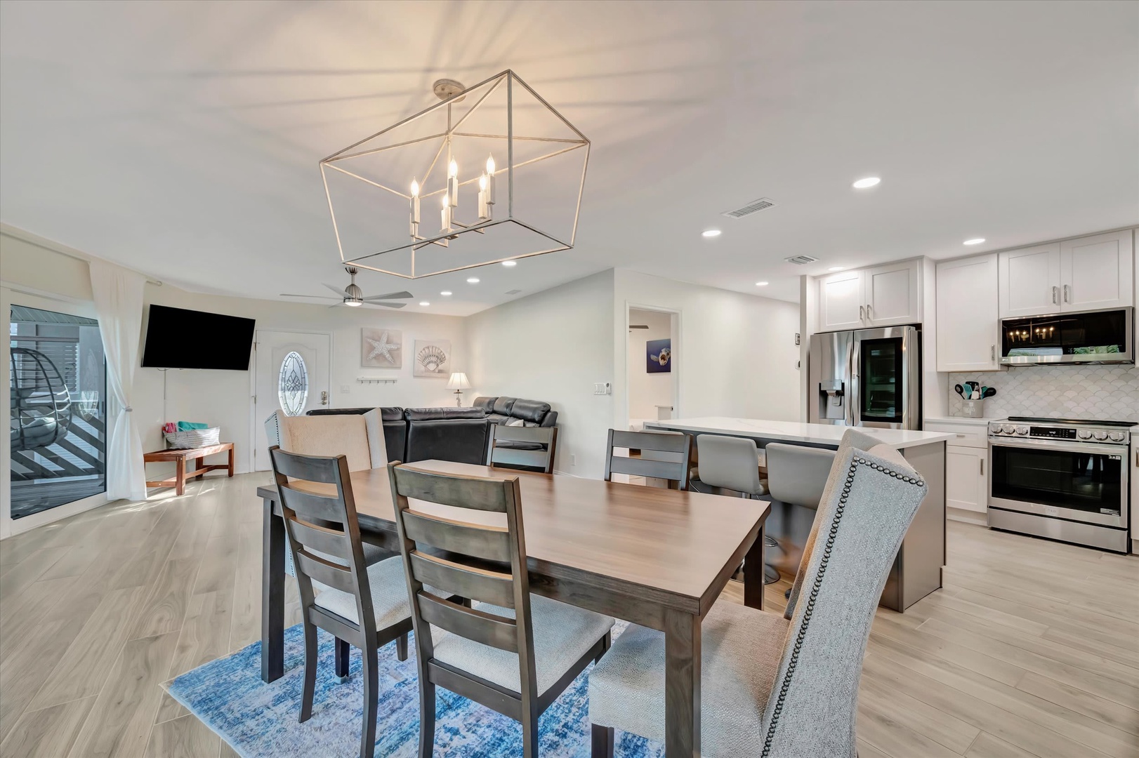 Beautifully designed open-concept living space filled with natural light, elegant finishes, and modern fixtures—the perfect gathering spot for your family vacation.