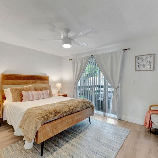 Unwind in your serene bedroom, where natural light filters through the balcony and a plush bed awaits your restful nights.