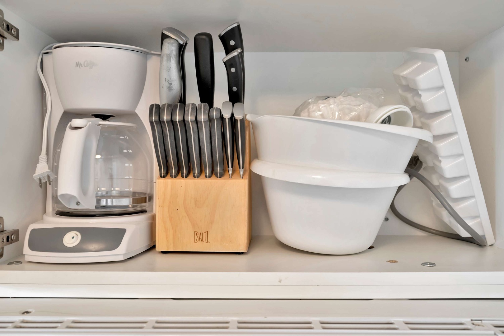 Your kitchen is thoughtfully equipped with everything you need, including a coffee maker, knife set, and mixing bowls ready for cooking up memorable meals together.