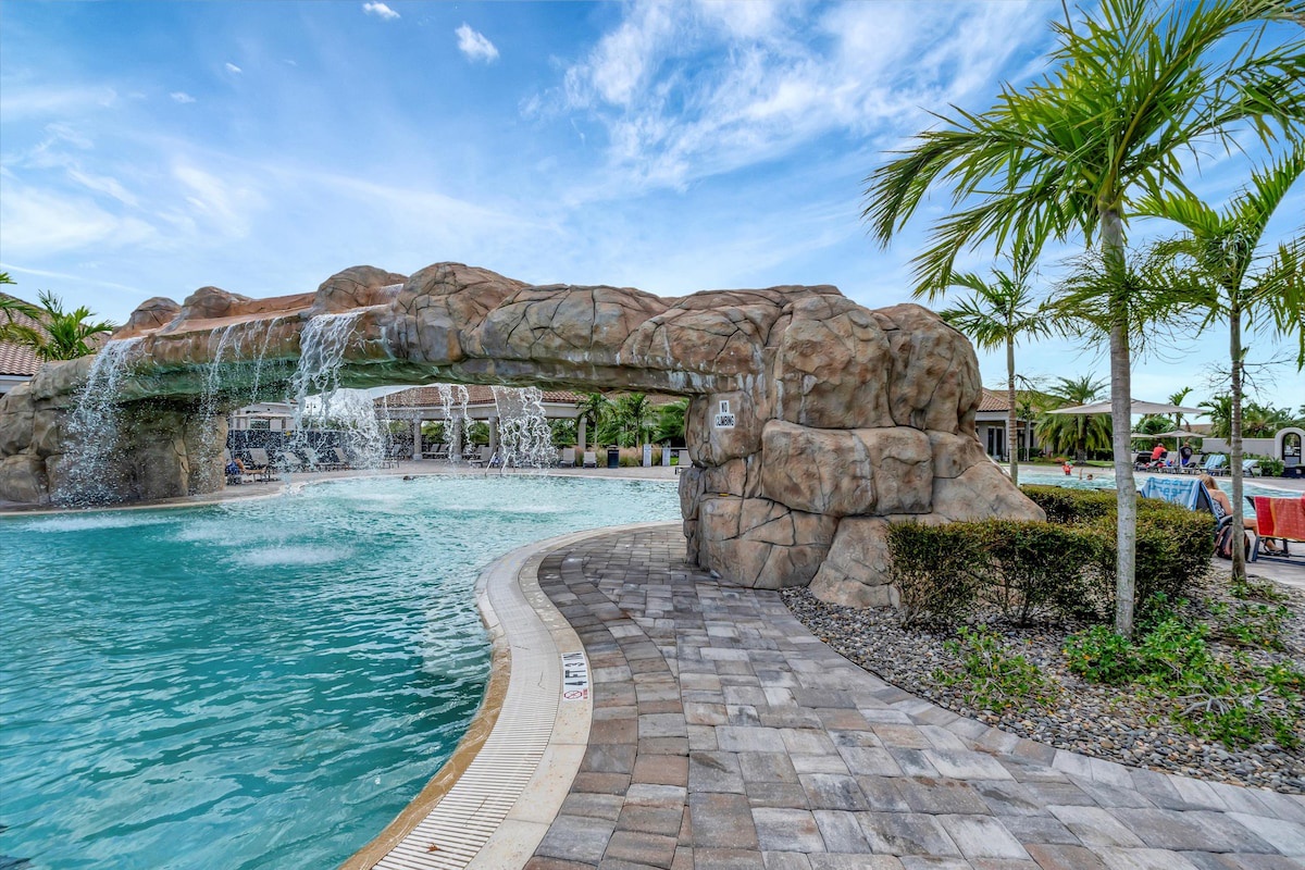 The resort's stunning pool features a dramatic rock waterfall, creating a tropical oasis perfect for your relaxation. Lounge by the sparkling water under swaying palms and soak in the sun-drenched Florida beauty.