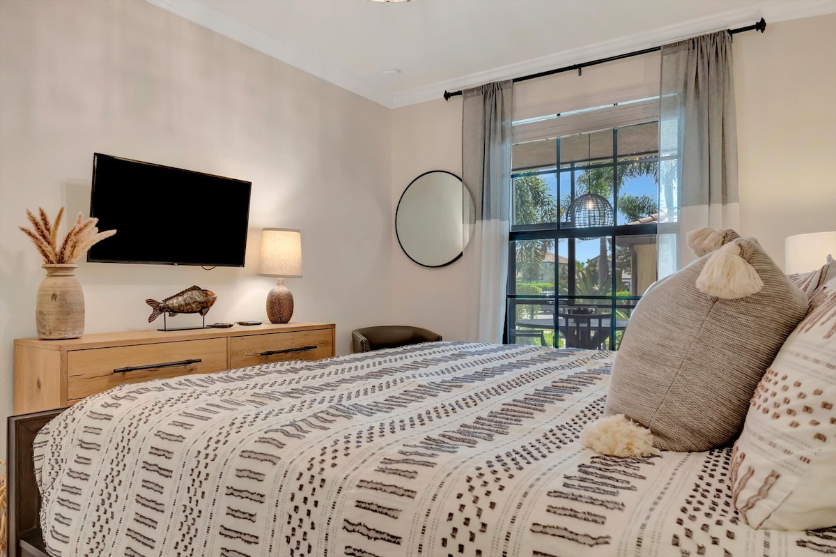 Sink into plush bedding and wake to gentle natural light filtering through your window, with a peaceful view of palm trees and greenery welcoming you to each Florida morning.