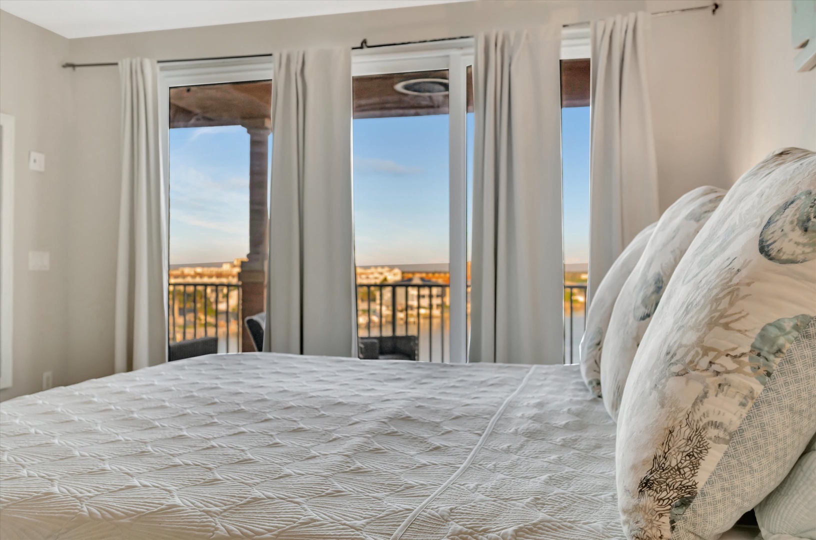 Wake up to stunning views through your private balcony doors. Soft linens and natural light create a peaceful retreat where relaxation comes naturally.