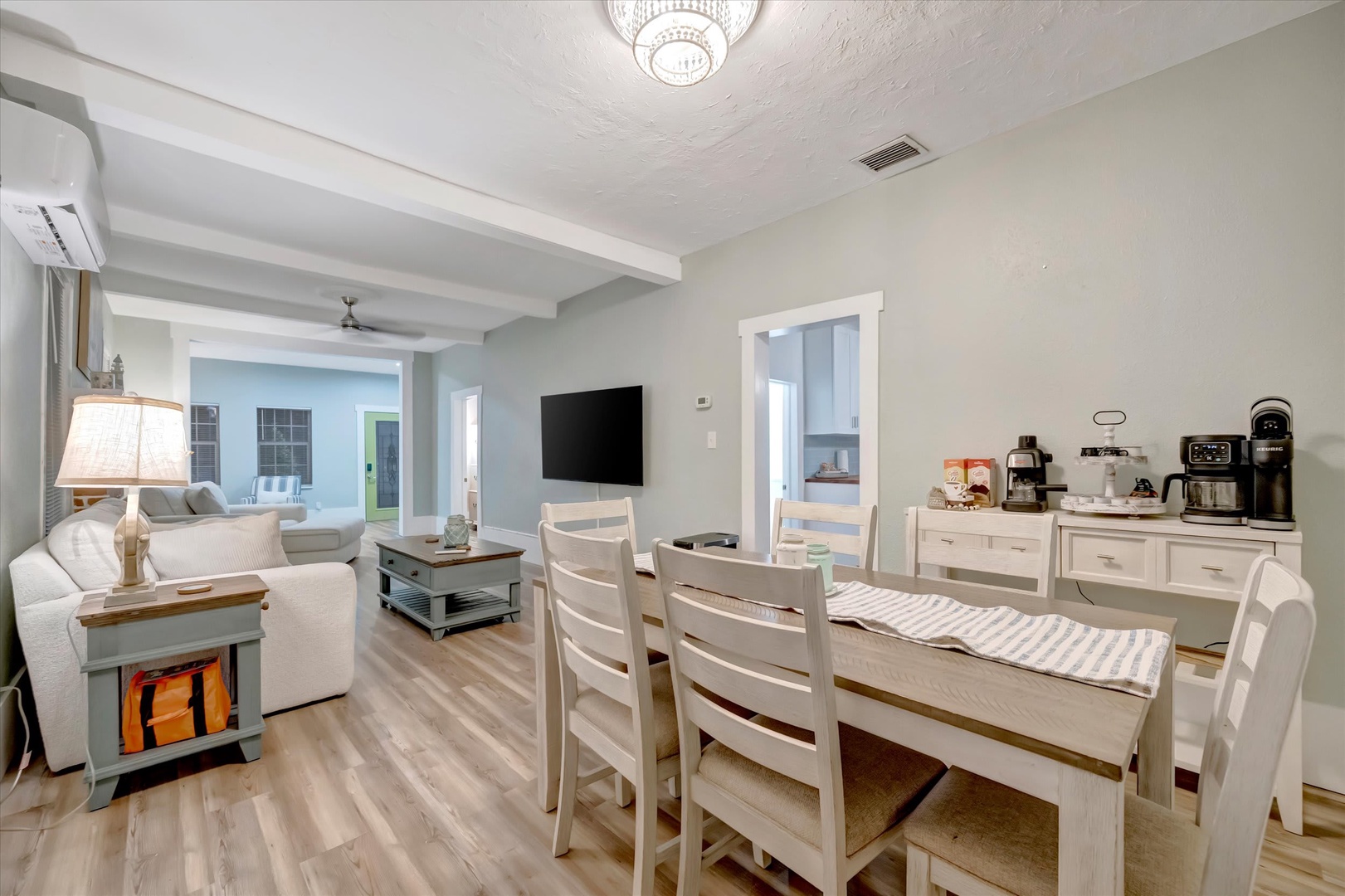 Gather around the cozy dining table for morning coffee or game night, with open-concept space flowing seamlessly into the living area where you'll unwind after exploring.