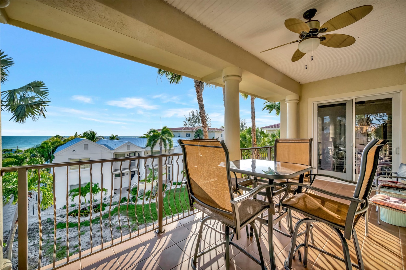 Unwind on your private balcony with a table for morning coffee or sunset cocktails, just steps from the turquoise waters and swaying palms of paradise.