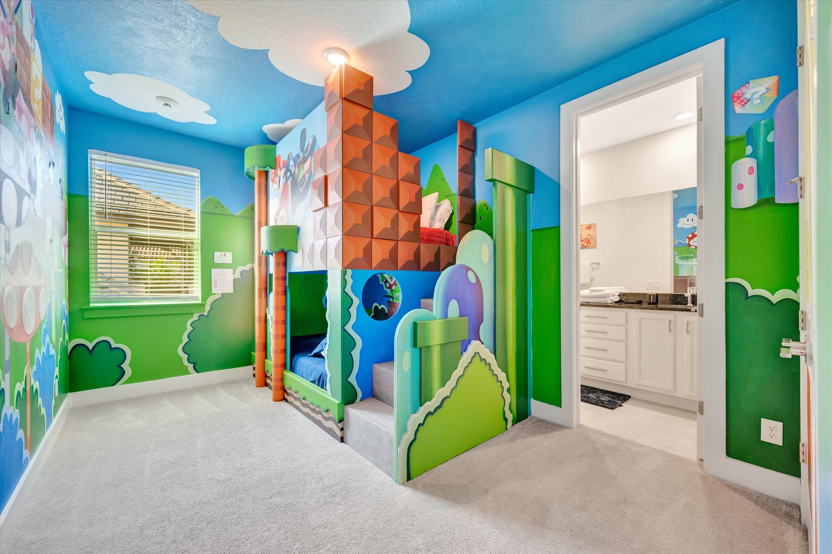 Your little ones will love this vibrant, imaginative bedroom themed like a classic video game world—complete with pixelated clouds on the ceiling and a cozy castle-themed bed tucked into the corner.