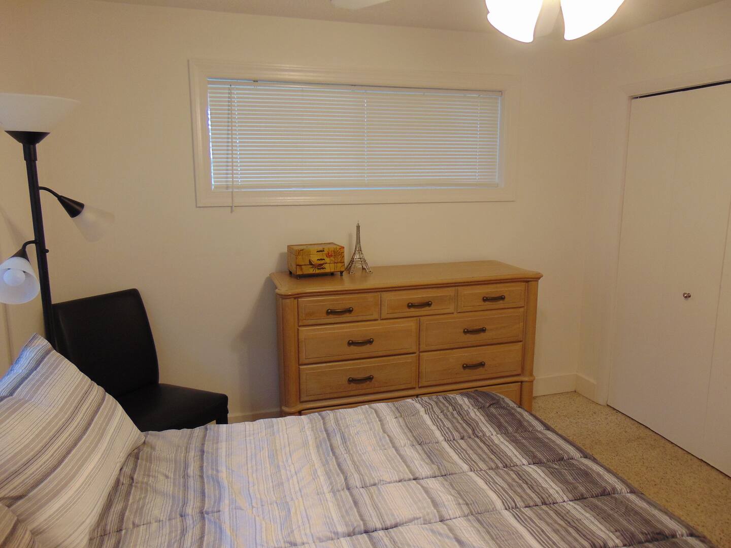Settle into your cozy bedroom with comfortable bedding and ample storage space for all your belongings. The warm wood dresser and closet keep everything organized during your stay.