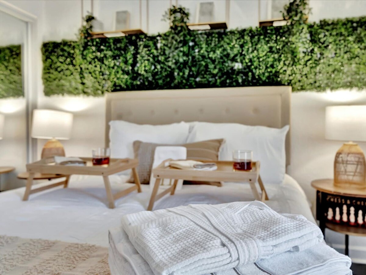 Sink into luxurious comfort in your serene retreat, where a living greenery wall and soft ambient lighting create a peaceful, spa-like atmosphere just for you.