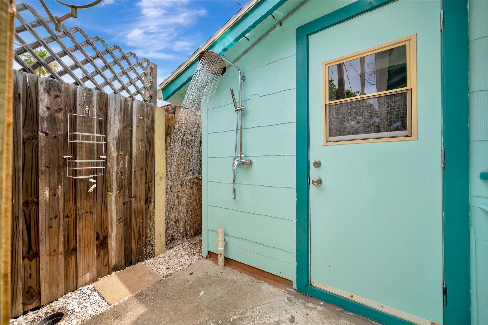 Rinse off after a sun-soaked day in your private outdoor shower, surrounded by tropical charm and open sky.