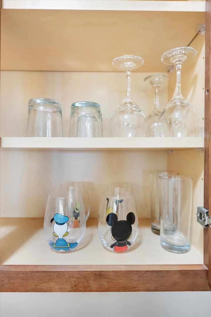 Your kitchen comes stocked with glassware for every occasion, from wine glasses to tumblers, all neatly organized and ready for your use.