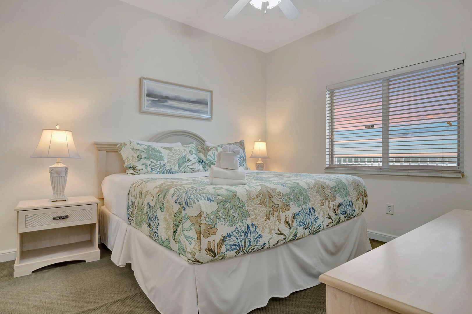 Wake up refreshed in your coastal-inspired bedroom, where soft tropical bedding and gentle lighting create your perfect retreat after a day of seaside adventures.