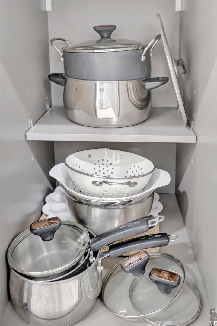 Your kitchen is fully equipped with quality cookware including stainless steel pots, pans, and a colander—everything you need to prepare delicious home-cooked meals during your stay.