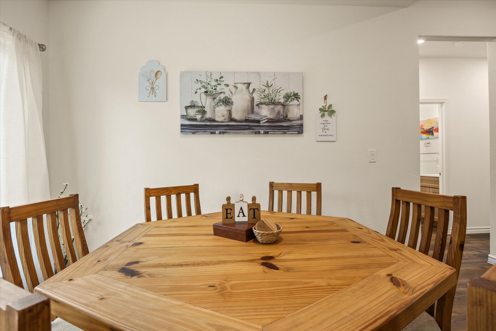 Gather around this warm wooden dining table for meals and memories with your group, surrounded by simple farmhouse charm that feels like home.