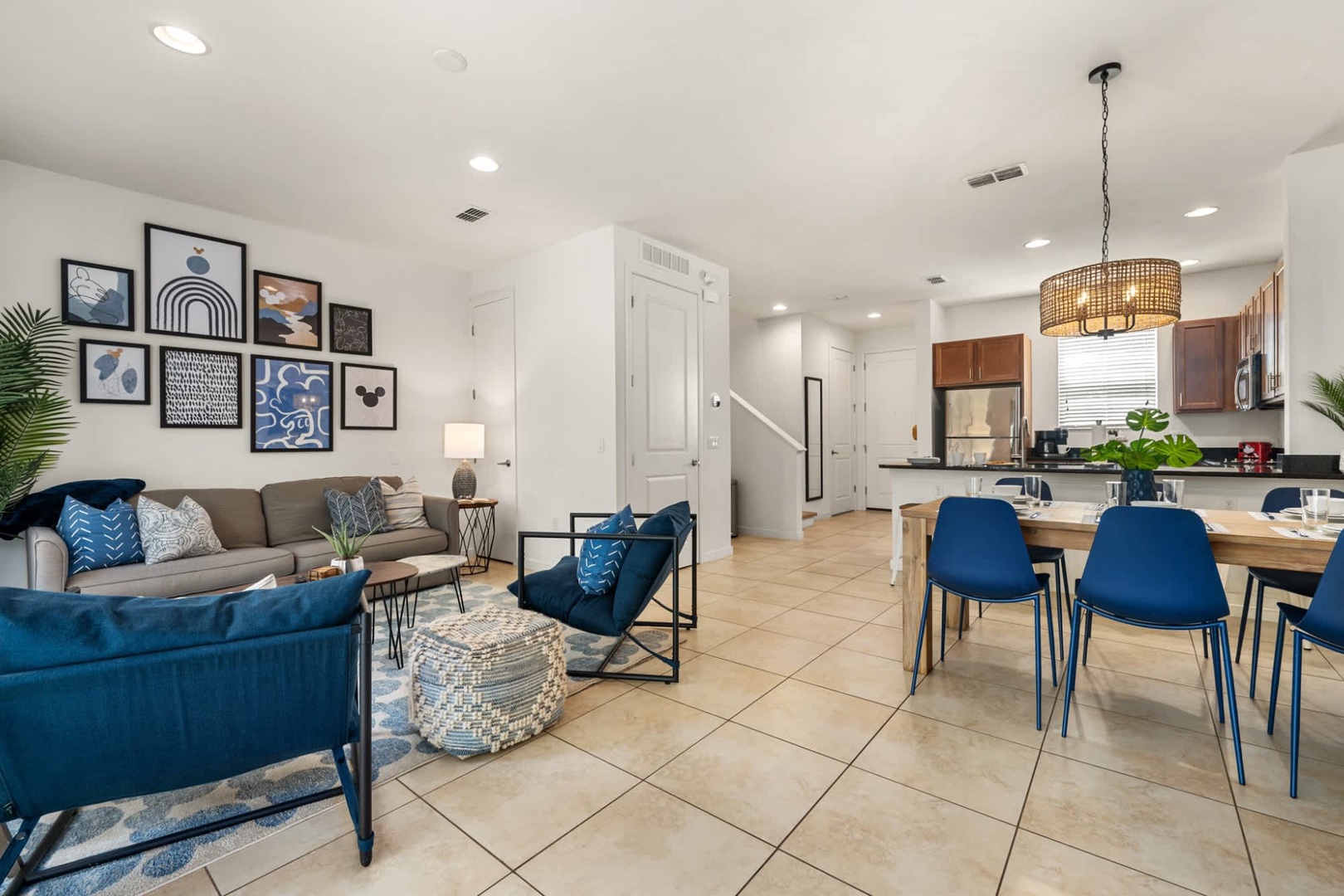 Your open living and dining area invites you to unwind on plush sofas or gather around a welcoming table for meals and conversations in stylish, bright comfort.
