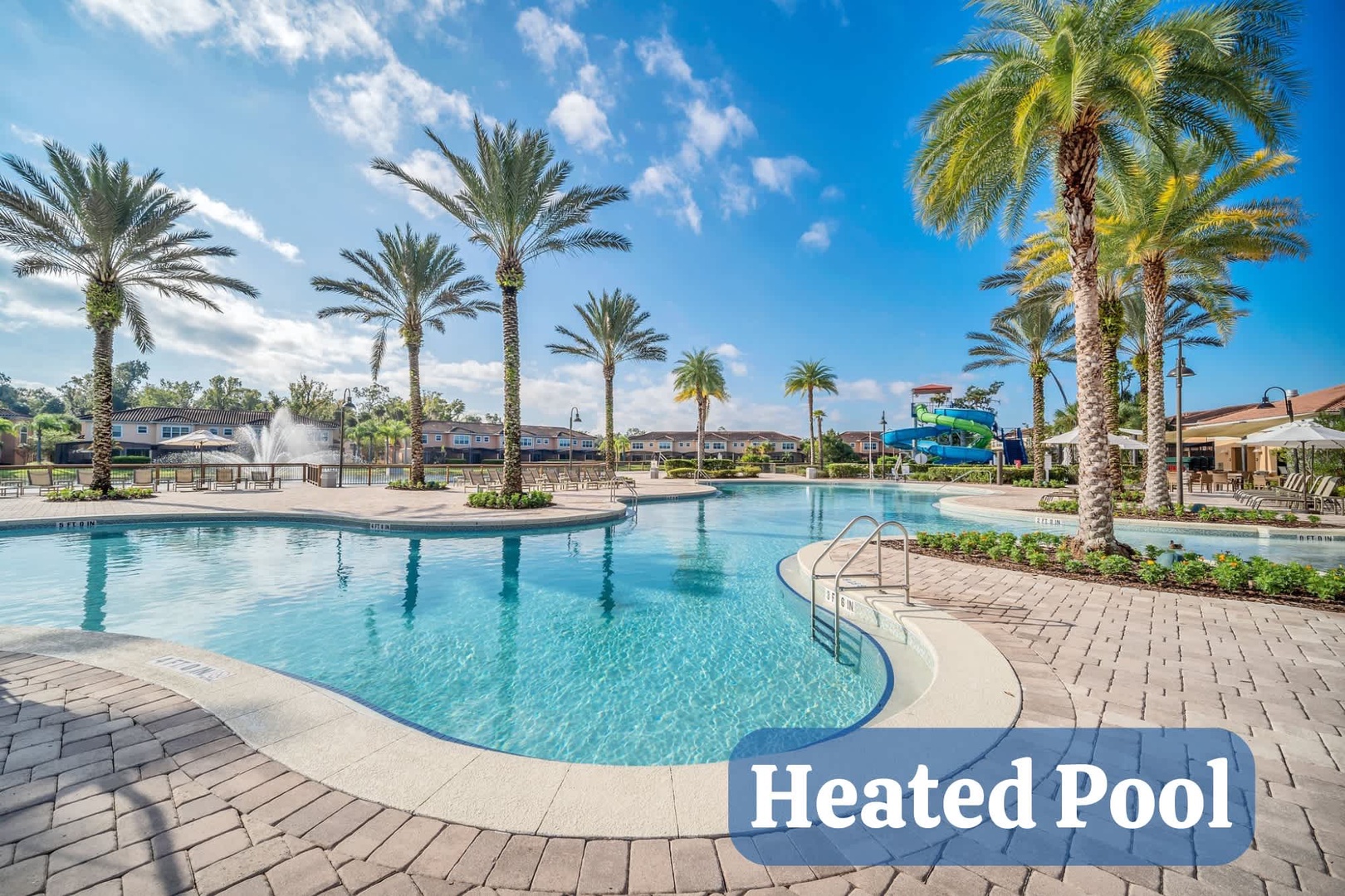 This expansive resort-style pool beckons with crystal-clear waters beneath swaying palms and a brilliant sky, perfect for your next sun-soaked escape.