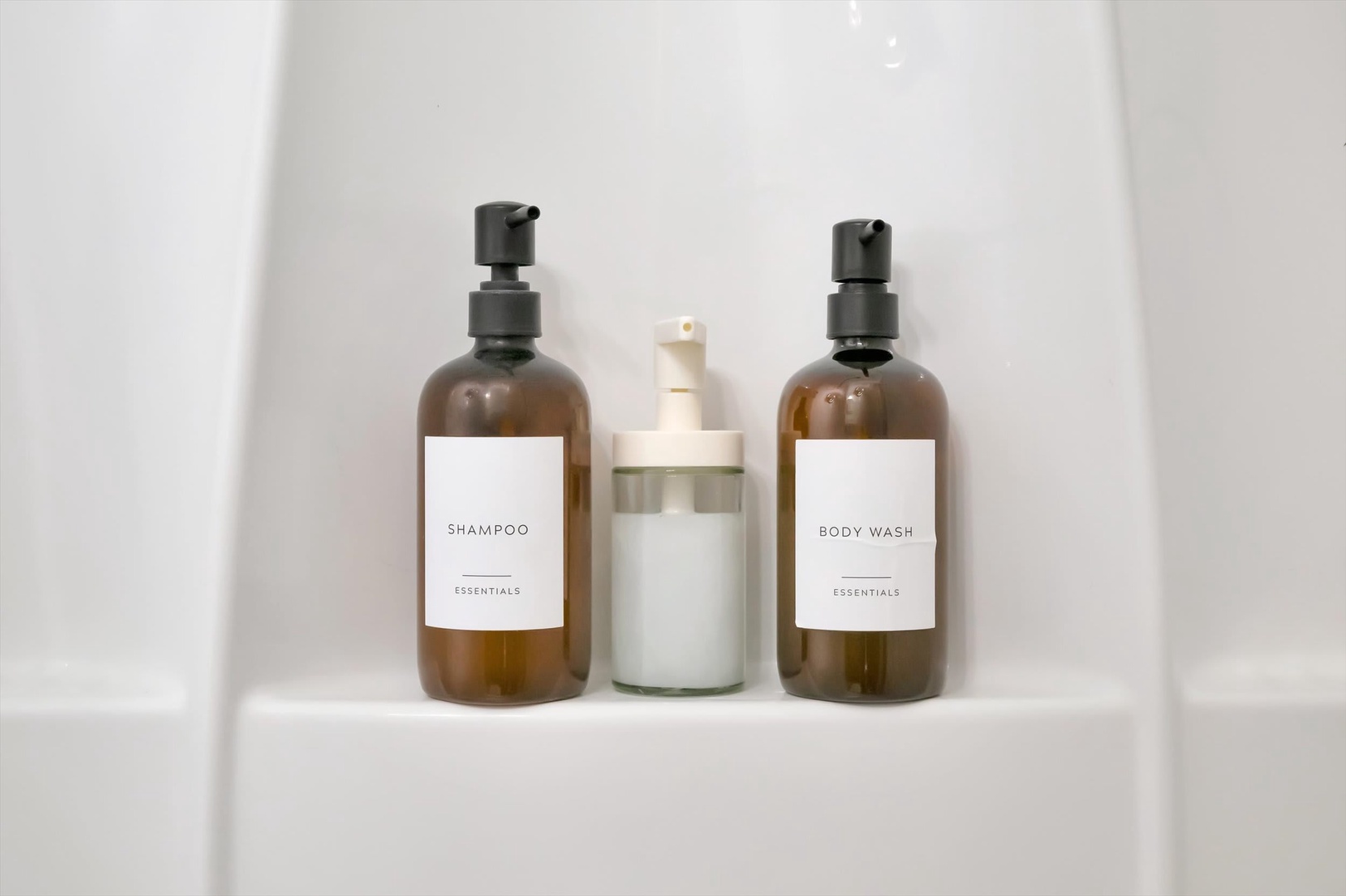 Premium essentials await you in the bathroom—quality shampoo, conditioner, and body wash for a refreshing start to your day.
