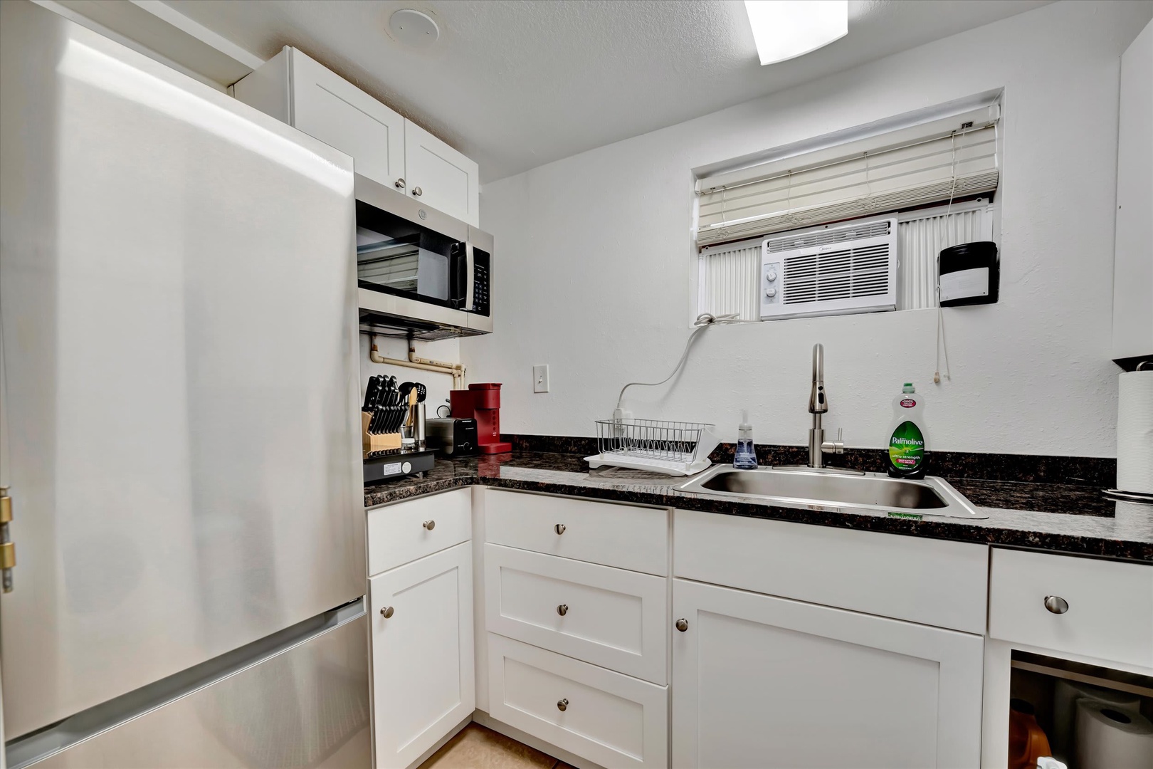 This bright, fully-equipped kitchen has everything you need to whip up your favorite meals during your stay, with modern appliances and ample counter space for easy meal prep.