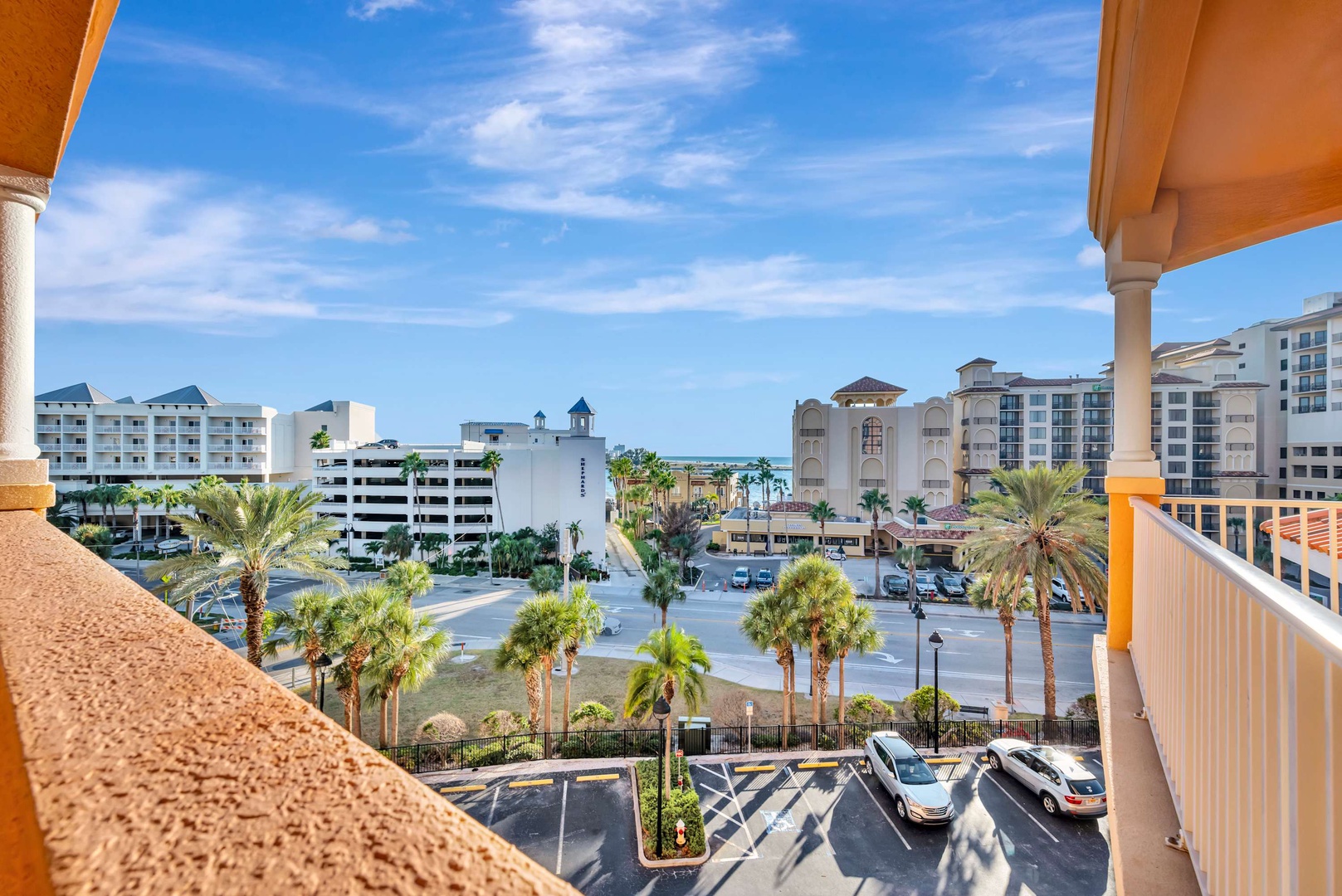 The property offers a convenient location within a vibrant coastal community. Parking is available on-site, with nearby amenities and the beach just a short distance away.
