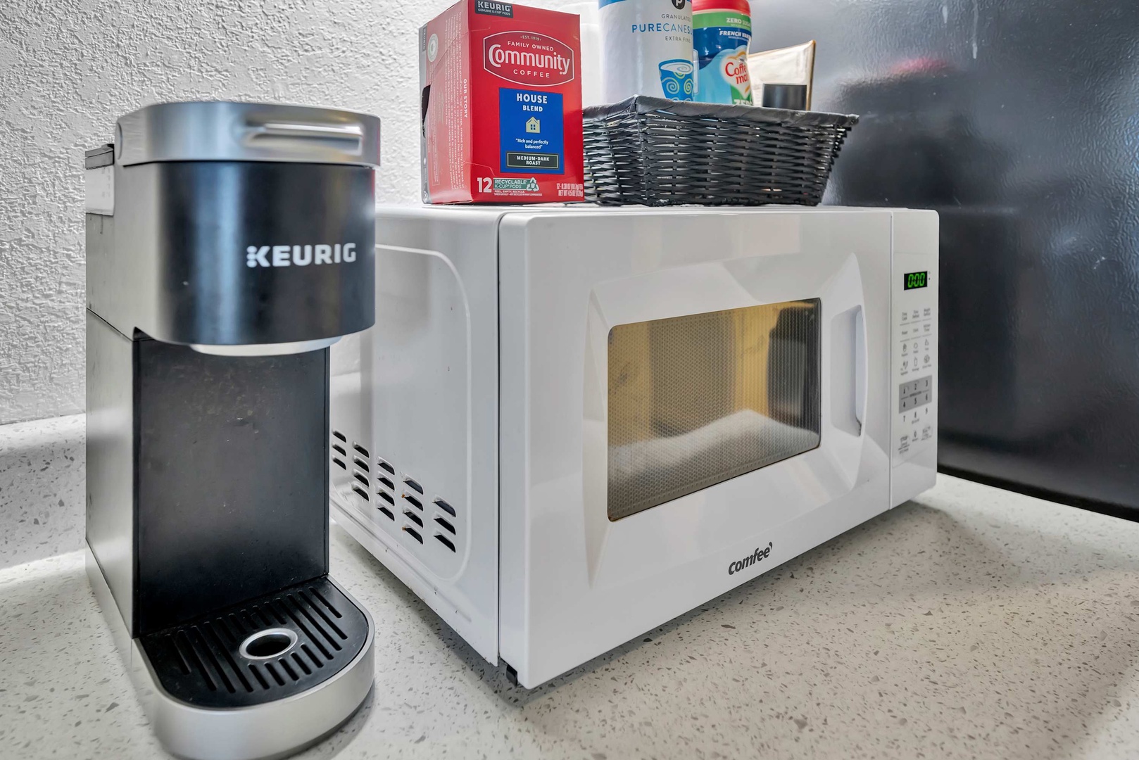 Start your mornings with ease using the Keurig coffee maker, with a microwave ready for quick bites and complimentary coffee supplies stocked for your convenience.