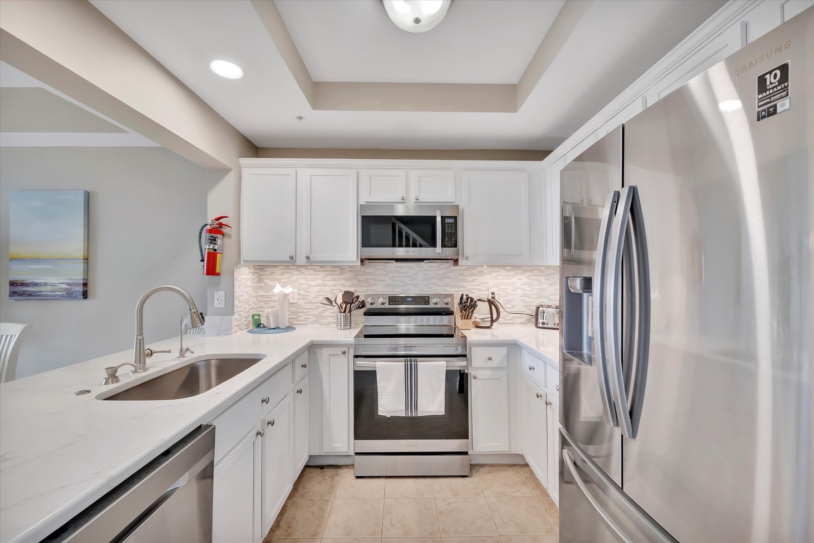 Your fully equipped kitchen features stainless steel appliances, gleaming countertops, and everything you need to prepare meals during your stay.
