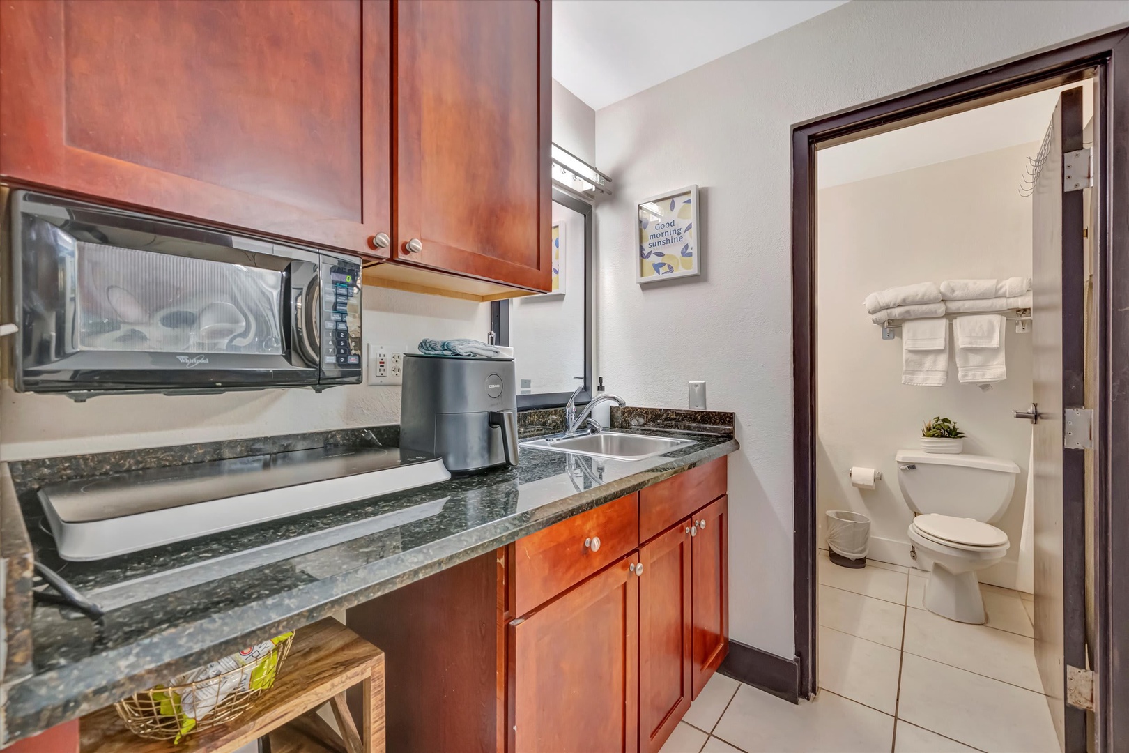 Your convenient kitchenette and private bathroom await, perfectly designed for easy meal prep and refreshing comfort during your stay.
