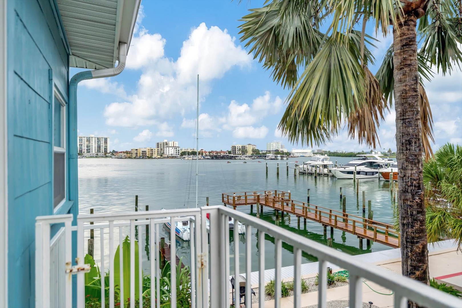 Waterfront living with swaying palms and a private dock just steps from your door—this is where your coastal escape begins.