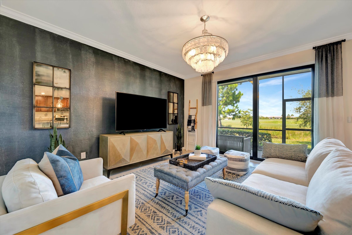 Sink into plush seating and let the natural light pour in through expansive windows. Your peaceful retreat offers a stylish space to unwind, with elegant touches and open views of the surrounding countryside.