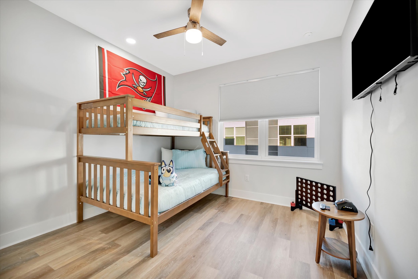 This bright bedroom features a sturdy bunk bed and plenty of space for your family to play and relax together after exploring the area.