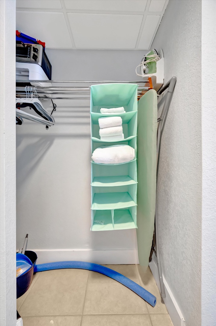Your closet comes thoughtfully organized with fresh linens, hangers, and a portable ironing board—everything you need to settle in and feel right at home.