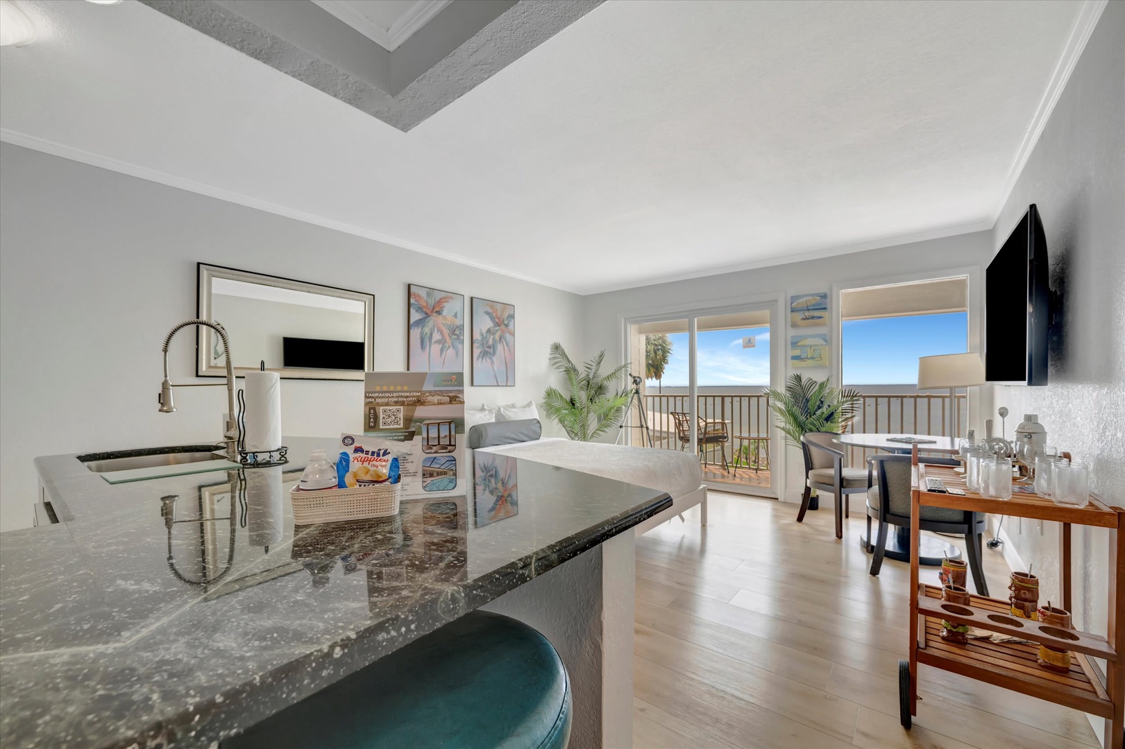 Unwind in your inviting open-plan space where natural light floods through sliding glass doors onto your private balcony. Step outside to savor ocean breezes and peaceful coastal views.